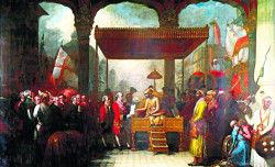 Grant of the Jaghire: Shah Alam II handing over the Firmauns granting the Jaghire of Chengalpattu, the Diwani of Bengal and the Enam of Northern Circars to Robert Clive, August 12, 1765 at Benaras. (Picture from Wiki Commons)